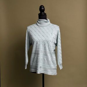 Light teal turtle neck with wavy texture